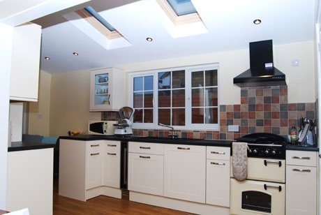 Kitchen with skylight and range cooker